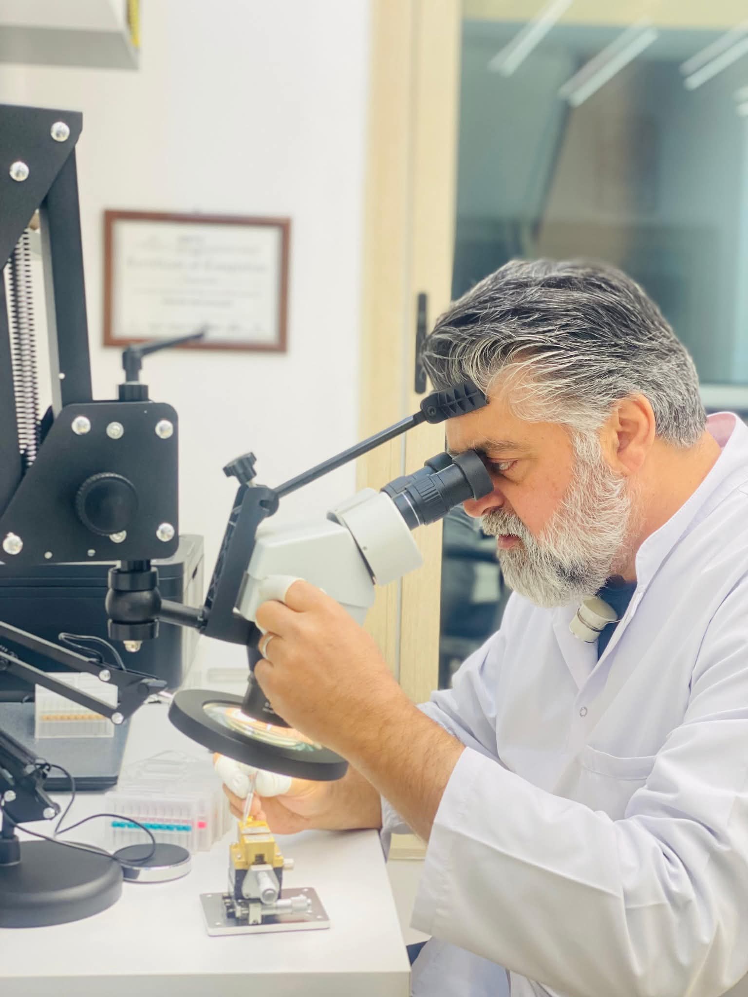 Nautilus watchmaker inspecting a luxury watch movement in the Dubai workshop
